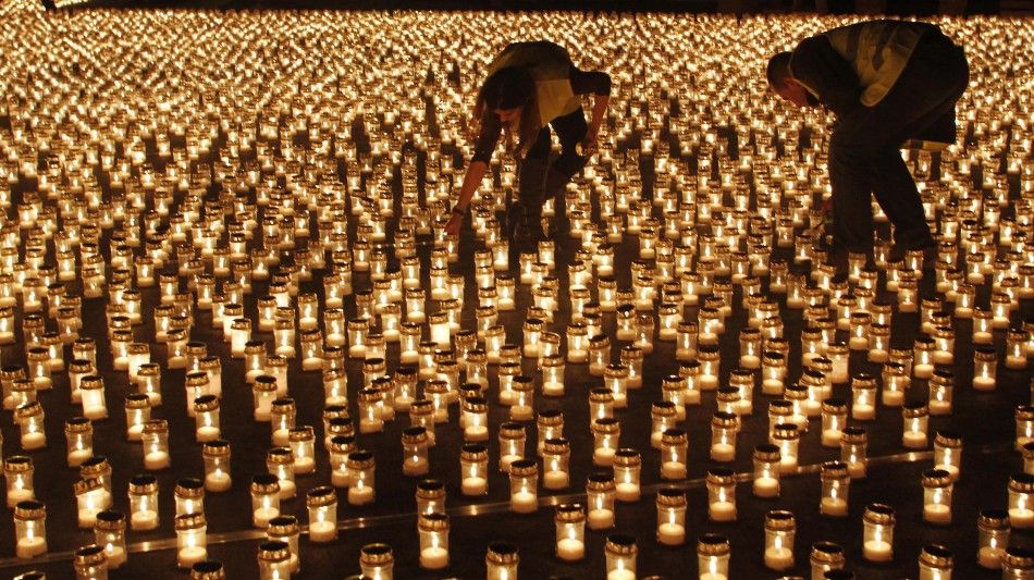 People light candles at Praca do Comercio in Lisbon December 17, 2011