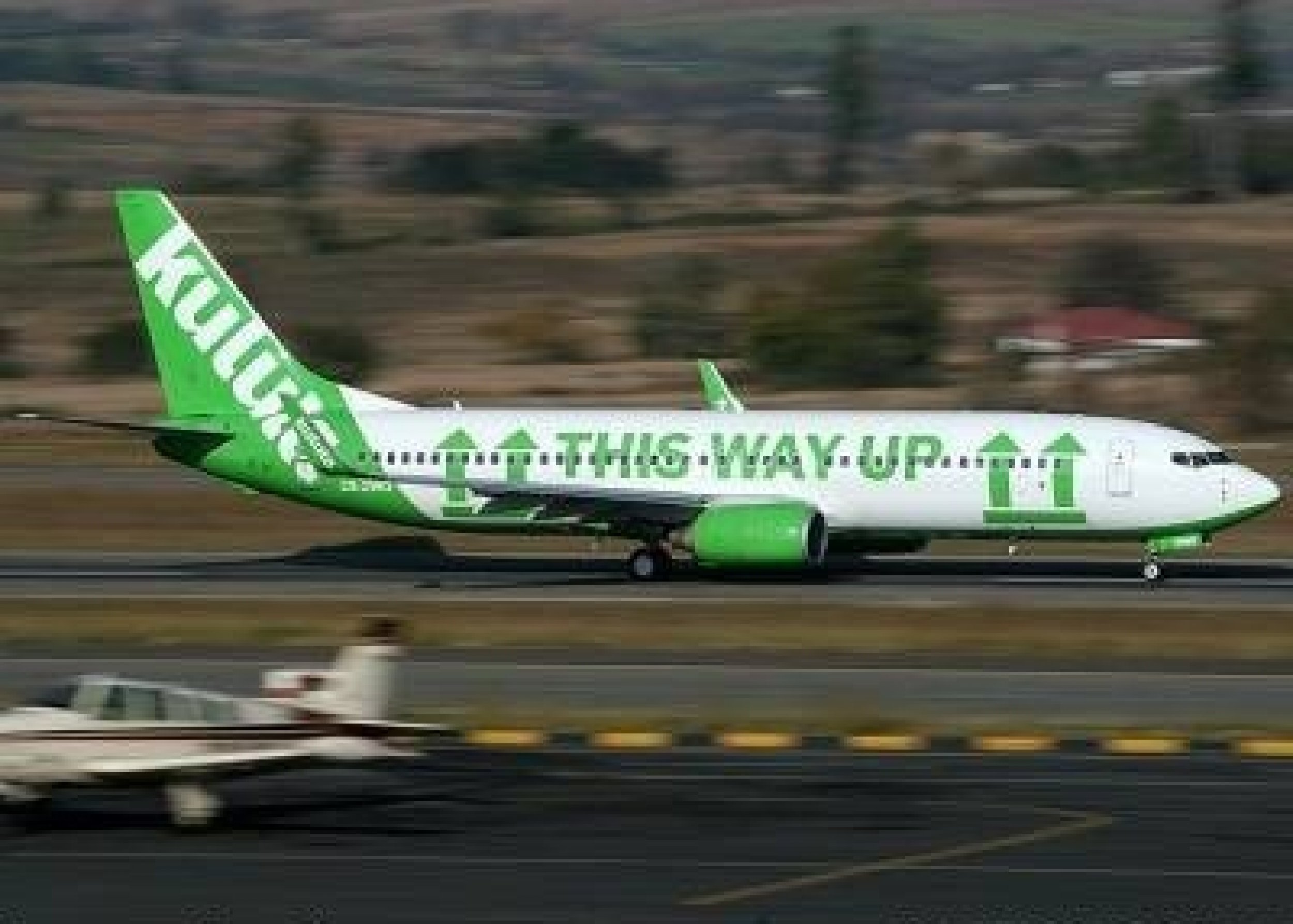 On this particular plane, Kulula uses humor to tell people which side of the plane should be up, which also doubly works to explain the only direction that the plane and the airline are headed. Here, we see Kulula ready for take-off.