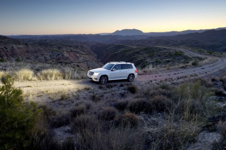 The new 2013 Mercedes-Benz GLK drives with its lights on.