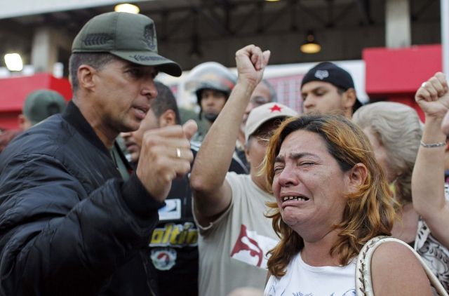 Supporters mourning the death of Chavez