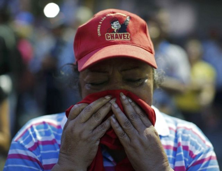 A supporter of Chavez mourns