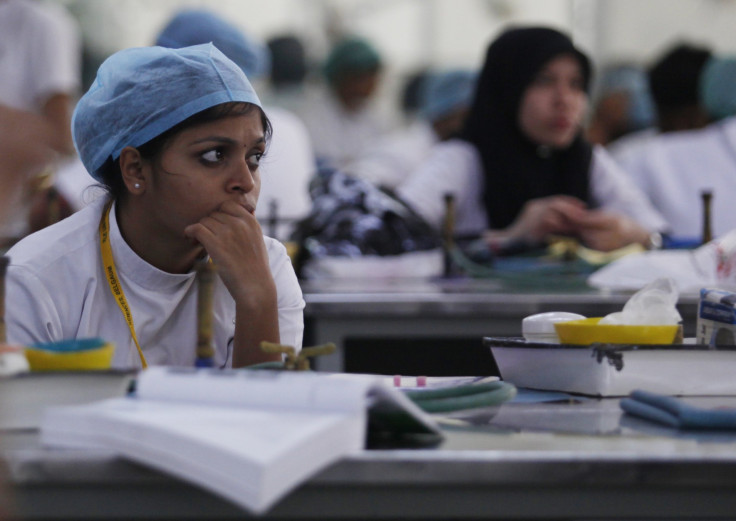 Students work on their lessons at the former dental school of Savita Halappanavar in Belgaum in the southern Indian state of Karnataka 