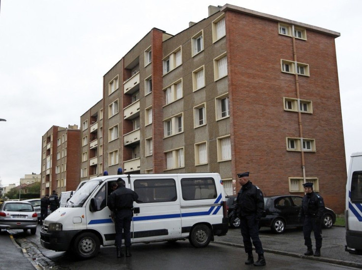 Police secure the street outside the five-storey apartment building where earlier special forces police staged the assault on the gunman Mohamed Merah in Toulouse
