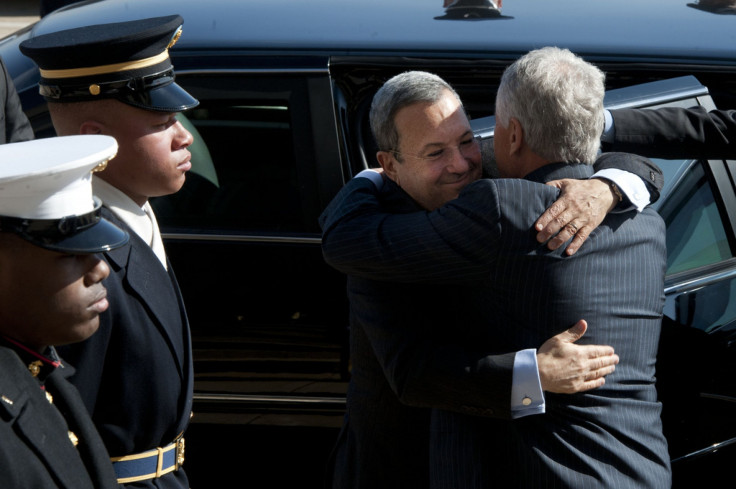 Hagel and Barak embrace at the Pentagon