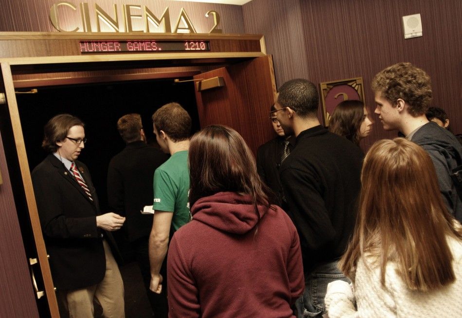 Movie attendees enter a theater on the opening night of quotThe Hunger Gamesquot at Regal Cinemas in Los Angeles, California March 22, 2012. 