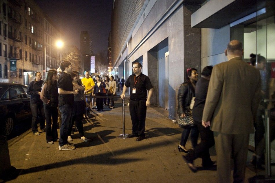 Fans line up to see the midnight shows of quotThe Hunger Gamesquot at the AMC Loews Lincoln Square Theatre in New York March 22, 2012. The film is based on the popular young adult book series by Suzanne Collins. 