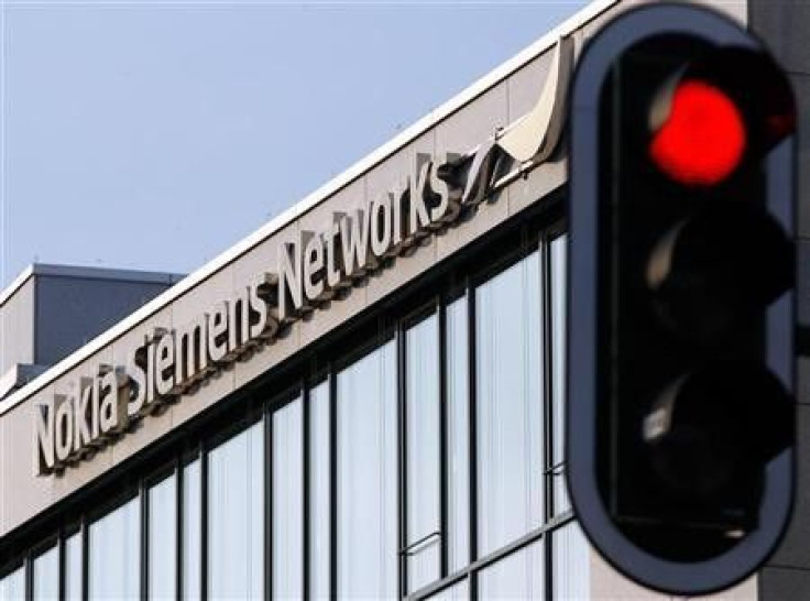 A red traffic light is seen next to the German headquarters of Nokia Siemens Networks in Munich January 31, 2012.