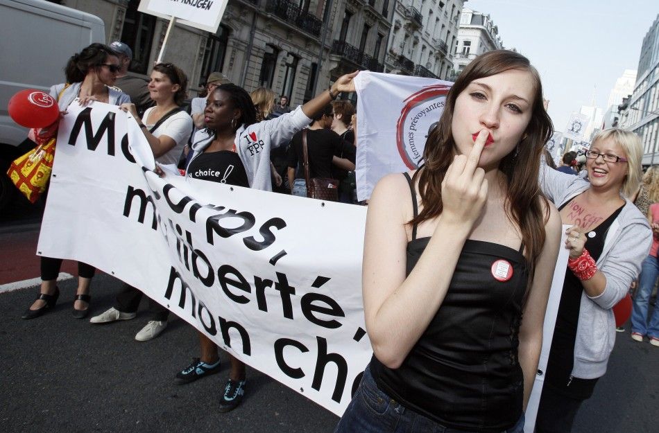 A woman poses during a SlutWalk rally against sexual abuse and inequality in Brussels