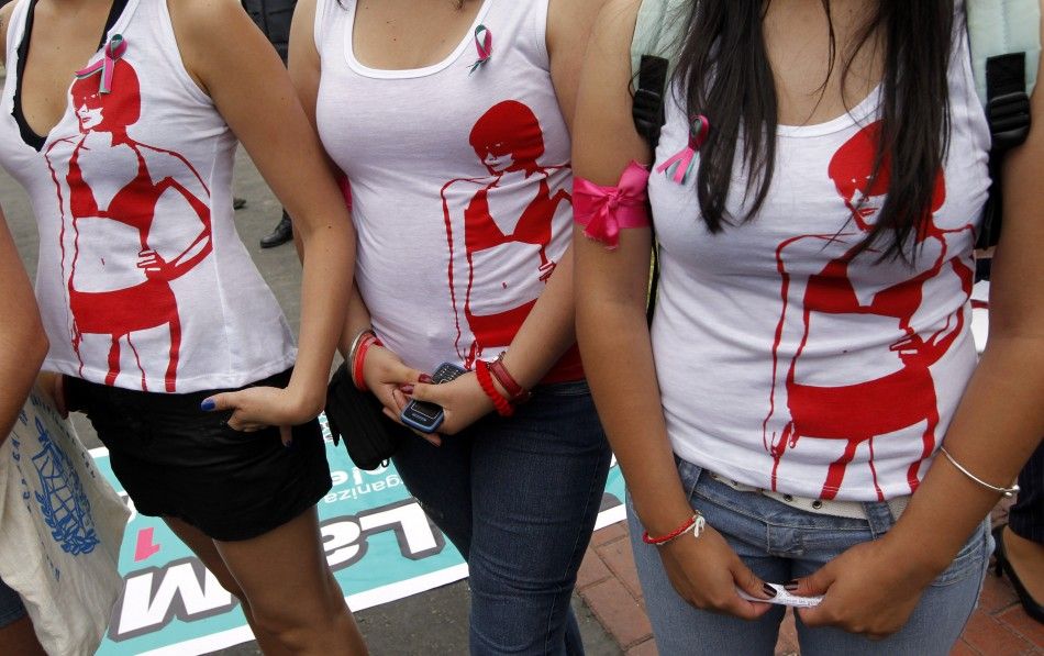 Women take part in the SlutWalk, held to protest against discrimination and violence against women in Lima
