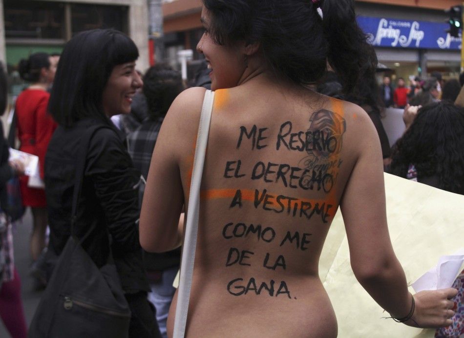 A woman takes part in a quotMarch of the whoresquot to protest against discrimination and violence against women in Bogota