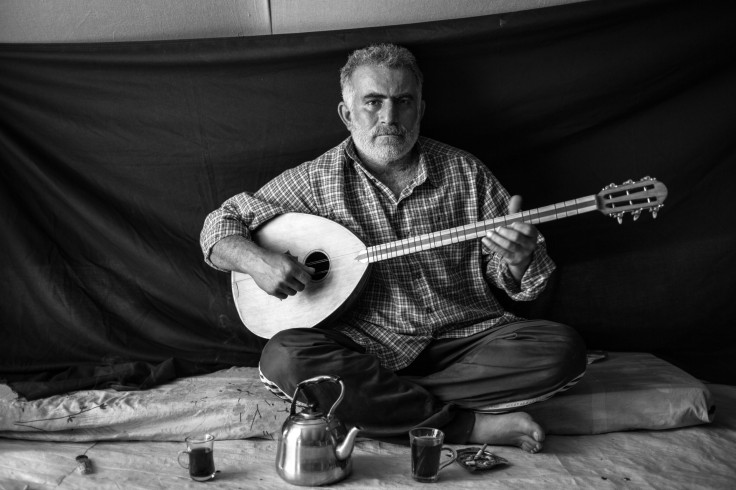 Syrian Refugee Man With His Musical Instrument