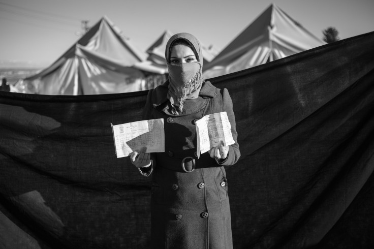 Young Syrian Refugee Woman With Her Diplomas