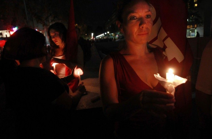 Residents and victims of the February 2010 magnitude 8.8 earthquake and ensuing tsunamis light candles as they gather in commemoration of the victims, in Santiago February 27, 2012.