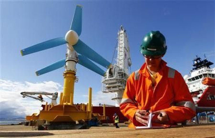 An engineer works near the Atlantis Resources AK-1000 tidal energy turbine before it is shipped to the European Marine Energy Centre test site in the Orkney Islands from the port at Invergordon, northern Scotland August 12, 2010.