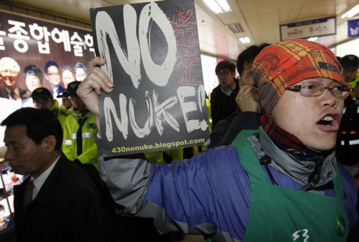 An anti-nuclear activist shouts slogans during a protest in Seoul