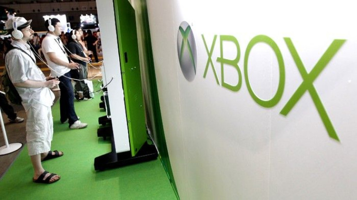 Visitors play with Microsoft&#039;s Xbox 360 consoles at the Tokyo Game Show in Chiba