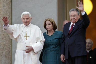 Pope Benedict XVI is welcomed by Cuban President Raul Castro at Revolution Palace in Havana.