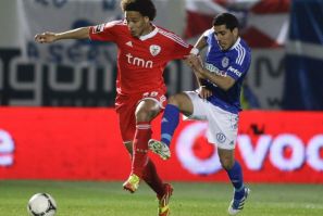 Manchester United are reportedly interested in Benfica midfielder Axel Witsel (L)