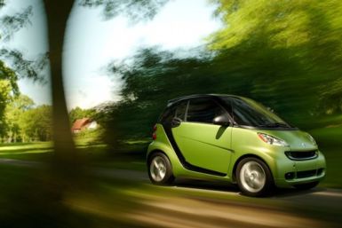 A Smart for Two Coupe drives.