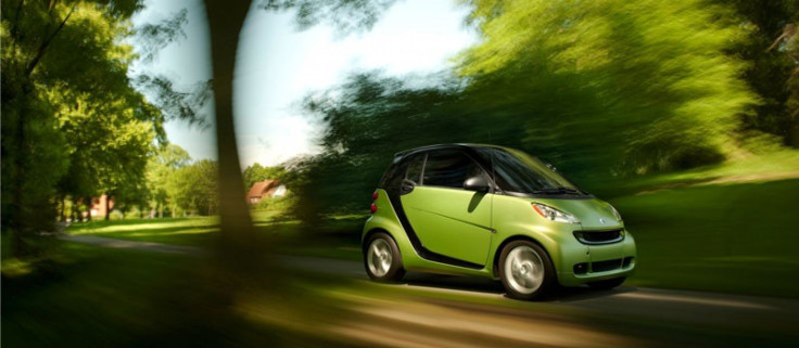 A Smart for Two Coupe drives.
