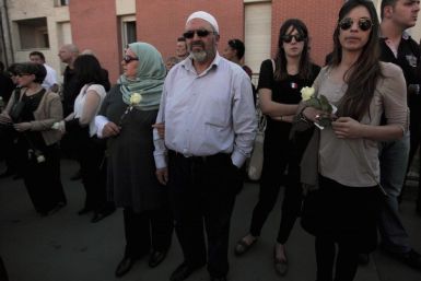 Muslim Couple attends silent march to honour victims of shooting at Ozar Hatorah school in Toulouse