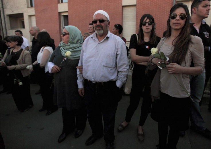 Muslim Couple attends silent march to honour victims of shooting at Ozar Hatorah school in Toulouse