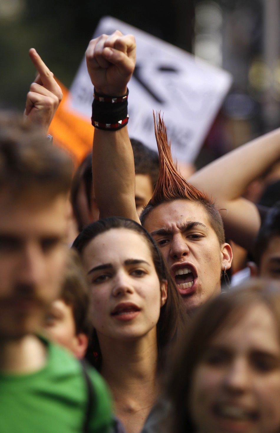 Protesters shout slogans in central Madrid during a general strike in Madrid