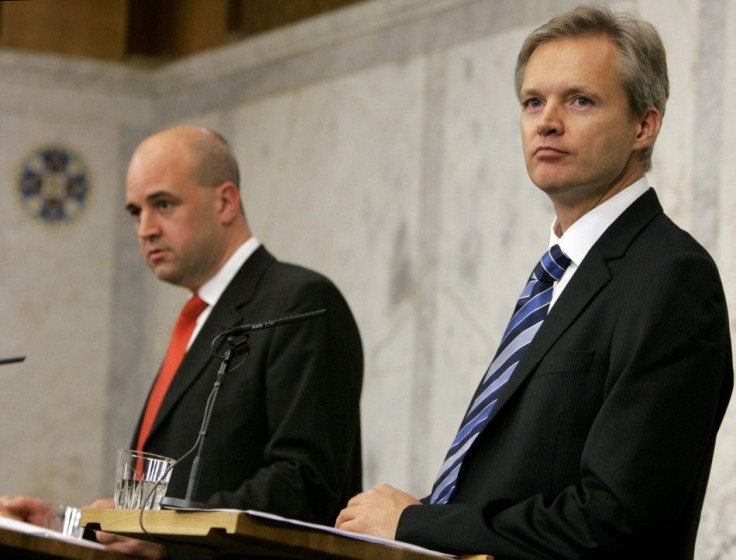 Sweden's Prime Minister Reinfeldt and Defence Minister Tolgfors during a news conference in Stockholm