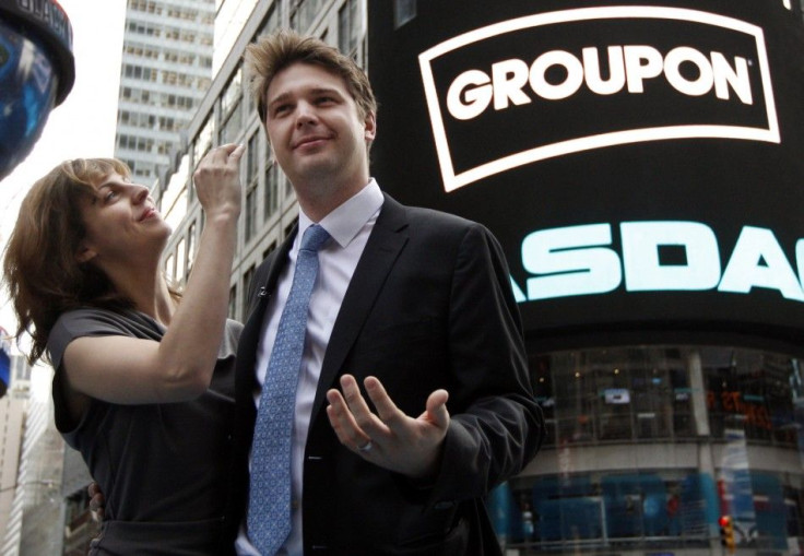 Groupon Inc. CEO Andrew Mason poses with his newly married wife, pop musician Jenny Gillespie, outside the Nasdaq Market following his company's IPO in New York, November 4, 2011.