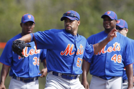 Mets opening day starter Johan Santana simulates a throw during a spring training workout.