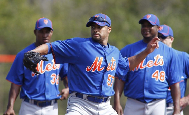 Mets opening day starter Johan Santana simulates a throw during a spring training workout.