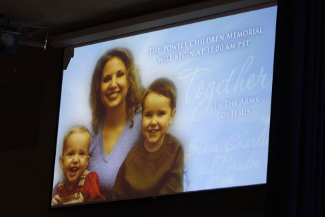 A picture of Susan Powell is seen on a screen with her children during funeral services in Tacoma