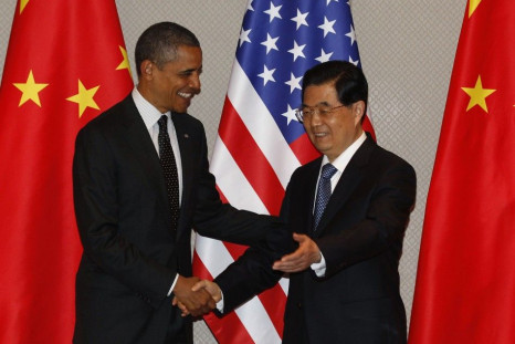 U.S. President Obama shakes hands with China&#039;s President Hu during expanded bilateral meeting in Seoul.