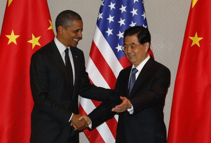 U.S. President Obama shakes hands with China&#039;s President Hu during expanded bilateral meeting in Seoul.