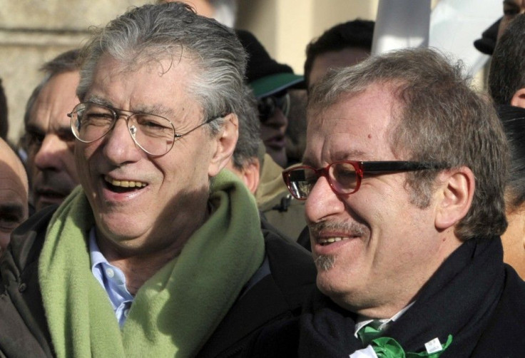 Northern League leader Umberto Bossi and Roberto Maroni attend a rally against the government in Milan