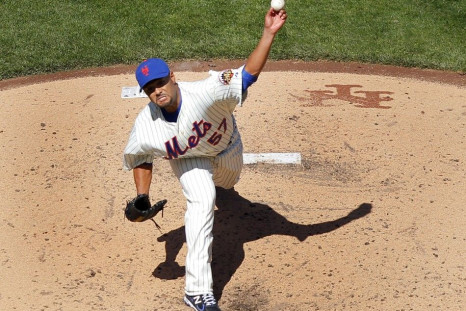 Johan Santana delivers a pitch against the Atlanta Braves on Opening Day.