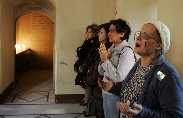 Syrian Armenians attend the Christmas Day Mass at Airmen Orthodox church in Damascus,