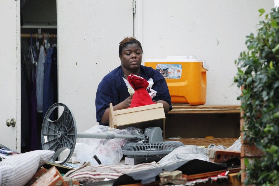 A resident sorts through belongings after a series of tornadoes ripped through the Dallas suburb of Lancaster