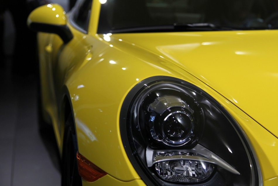 The iconic headlight of the Porsche 911, World Performance Car of the Year 2012, at the New York International Auto Show 2012.