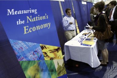 American University student Caitlin Treanor (R) speaks with job recruiter Jon Avery during a career job fair at American University in Washington March 28, 2012.