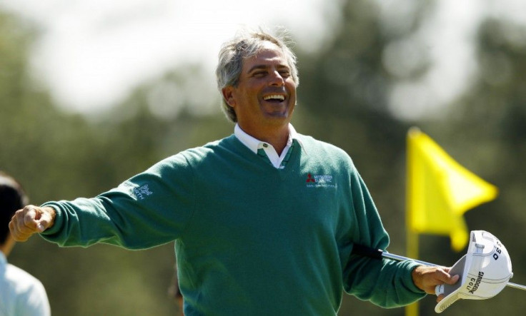 Fred Couples shares the Masters lead with Jason Dufner, while Tiger Woods falters and Rory Mcllroy puts himself in contention on day two at Augusta.