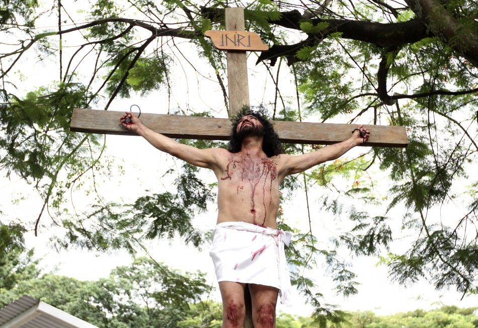 A man dressed as Jesus Christ takes part in a procession on Good Friday in Yumbo April 6, 2012. Hundreds of processions take place during the Holy Week in Colombia.