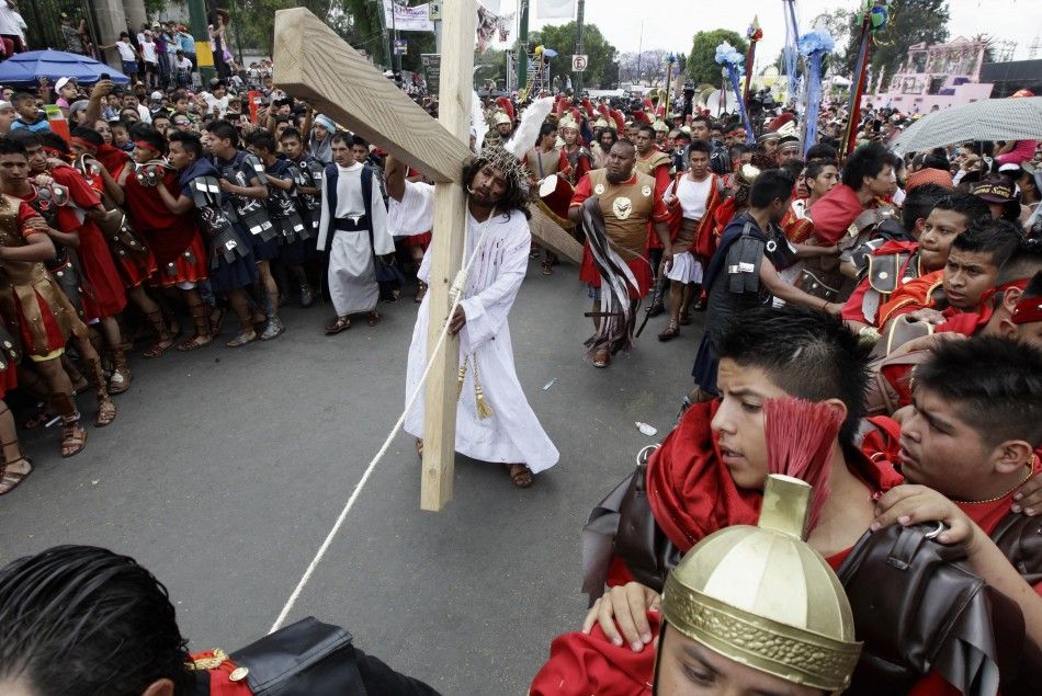 Penitents participate in a re-enactment of the crucifixion of Jesus Christ on Good Friday in Iztapalapa in Mexico City April 6, 2012. 