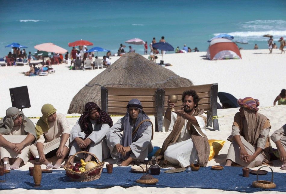 Penitents and actors re-enact the last supper on Playa Delfines Dolphin Beach on Good Friday in Cancun April 6, 2012.