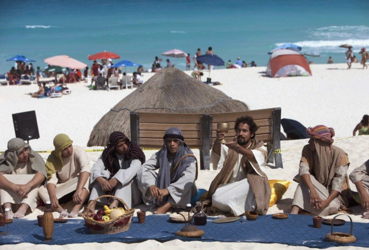 Penitents and actors re-enact the last supper on Playa Delfines (Dolphin Beach) on Good Friday in Cancun April 6, 2012.