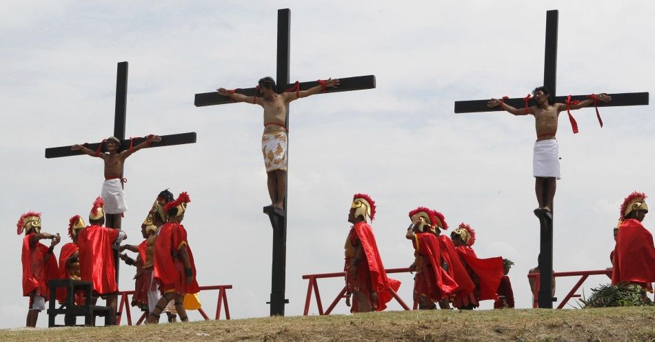 Filipino penitents are nailed to wooden crosses during a reenactment of Jesus Christs crucifixion during Good Friday in Barangay Cutud, San Fernando, Pampanga in northern Philippines April 6, 2012. 