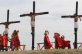 Filipino penitents are nailed to wooden crosses during a reenactment of Jesus Christ's crucifixion during Good Friday in Barangay Cutud, San Fernando, Pampanga in northern Philippines April 6, 2012. 
