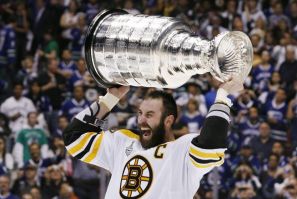 Bruins captain Zedno Chara celebrates with the Stanley Cup.