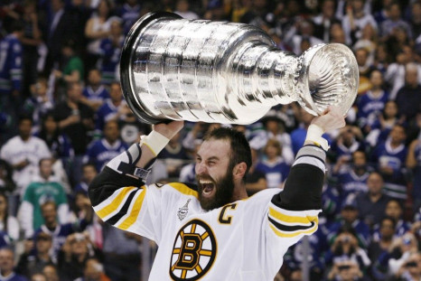Bruins captain Zedno Chara celebrates with the Stanley Cup.