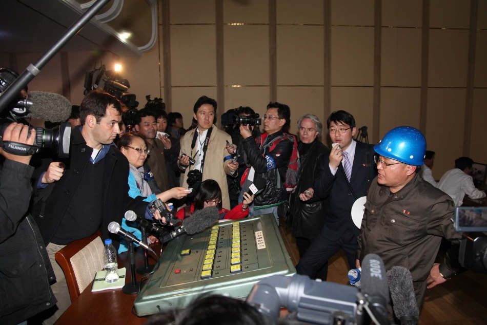 Foreign Journalists Surround a North Korean Representative